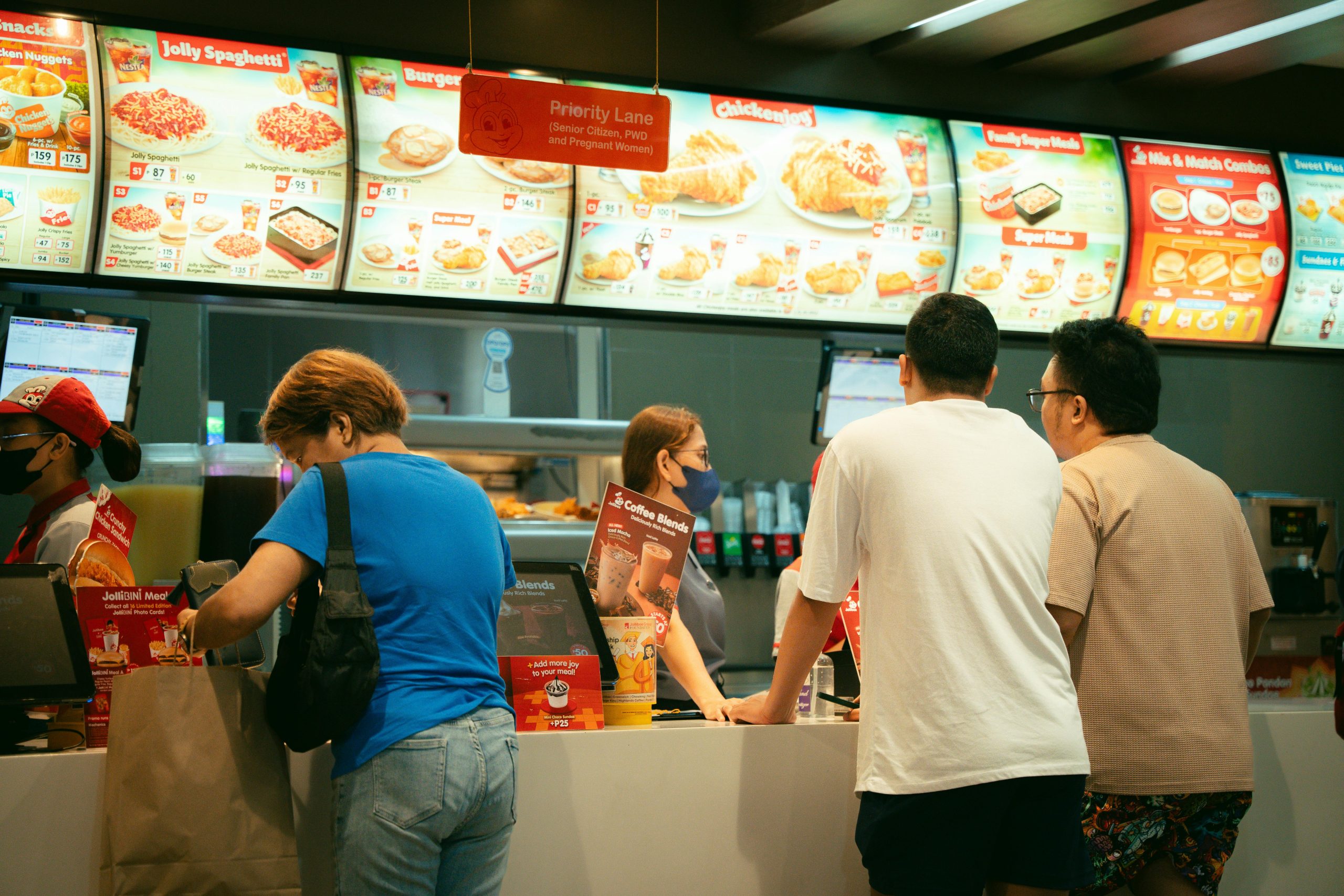 People standing in line at a fast food restaurant